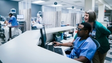 Providers using a computer in a hospital. Providers using a computer in a hospital.