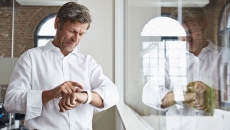 A person using a smartwatch. A person using a smartwatch.