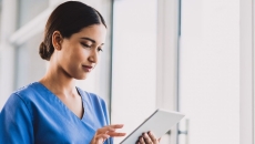 A nurse using a tablet A nurse using a tablet