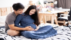 A pregnant woman and her partner A pregnant woman and her partner