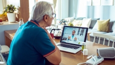 An older man talking to a provider via telehealth An older man talking to a provider via telehealth