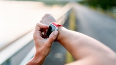 A close up of a person checking a smartwatch. A close up of a person checking a smartwatch.