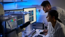 Researchers reviewing a software analysis Researchers reviewing a software analysis