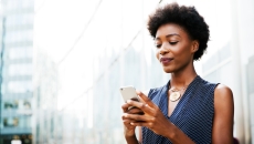 A person using a smartphone. A person using a smartphone.