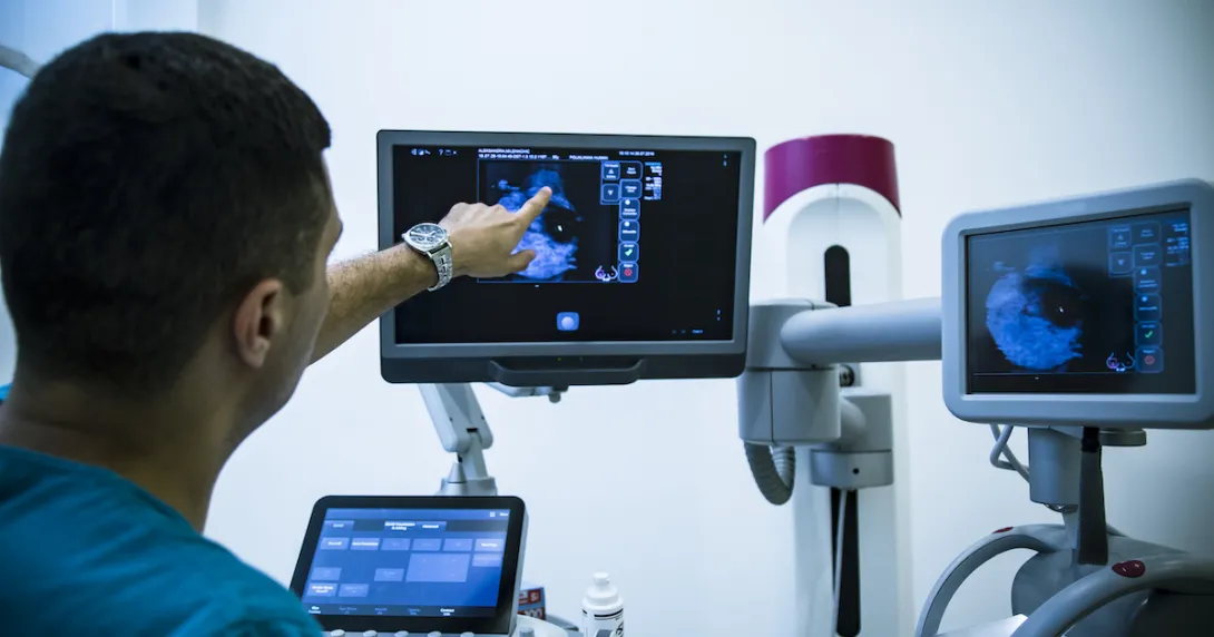 Healthcare provider reviewing a scanned image on a screen