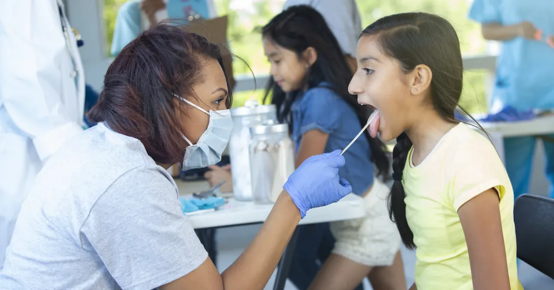 Healthcare provider examining a patient Healthcare provider examining a patient