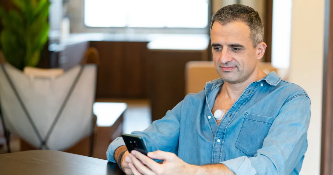 A model wearing a wearable stethoscope by Aevice Health