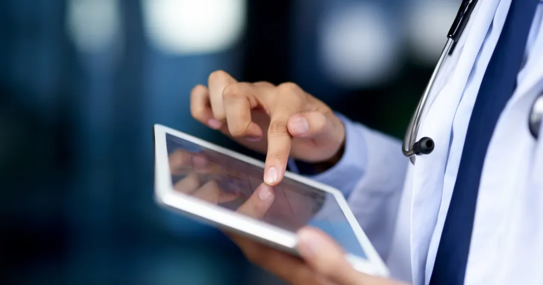Healthcare professional holding a tablet Healthcare professional holding a tablet