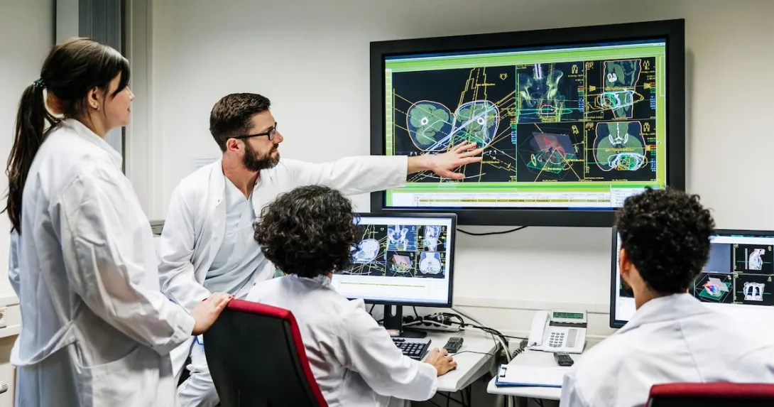 Four healthcare providers looking at a screen Four healthcare providers looking at a screen
