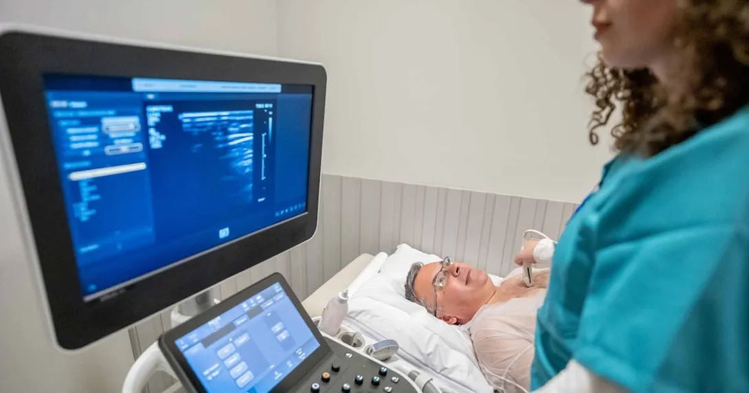 Technician conducting ultrasound exam Technician conducting ultrasound exam