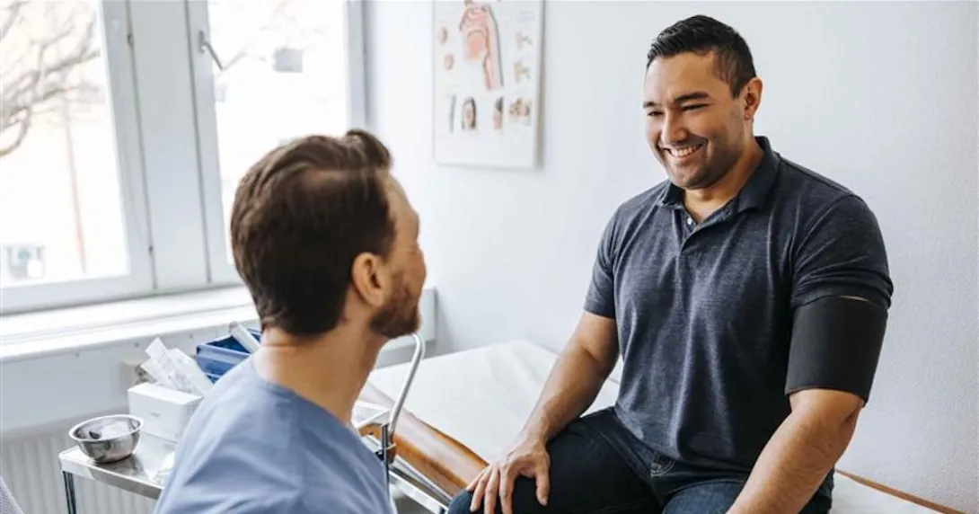 Patient sitting with a healthcare professional Patient sitting with a healthcare professional