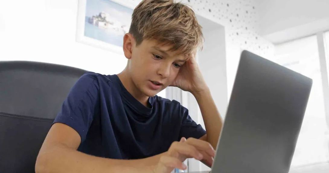 Person working on a laptop Person working on a laptop