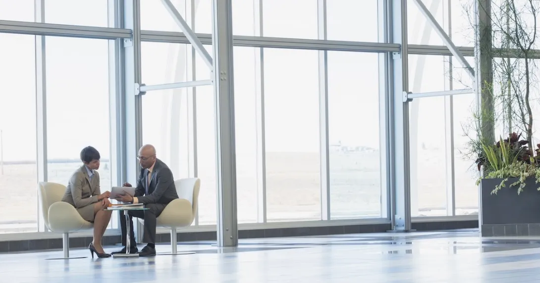 Two executives conferring Two executives conferring