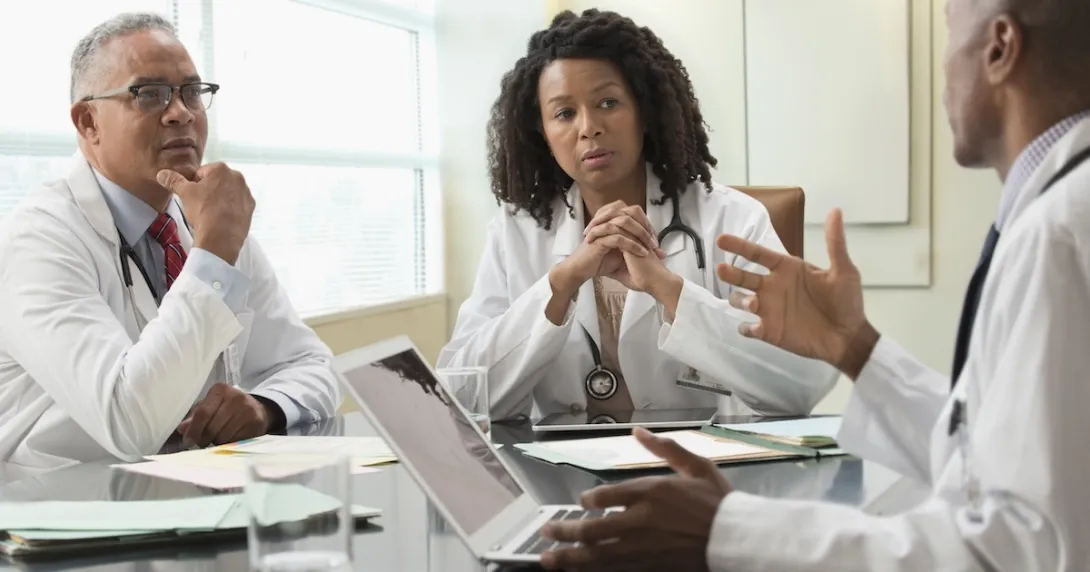 Healthcare professionals conferring Healthcare professionals conferring