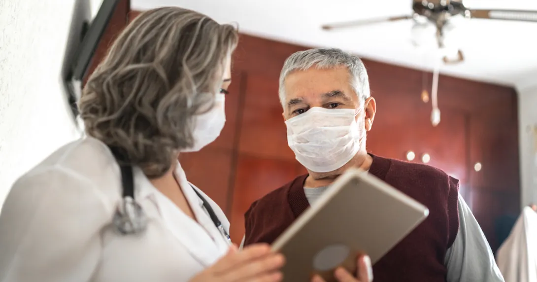 Healthcare provider and patient talking to each other Healthcare provider and patient talking to each other