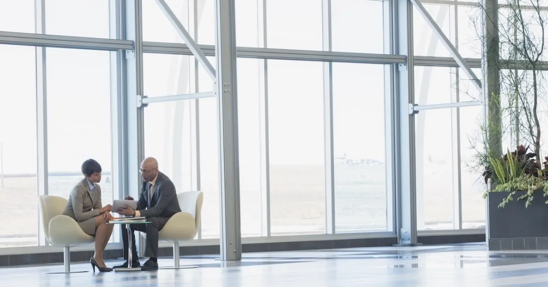 Executives conferring Executives conferring