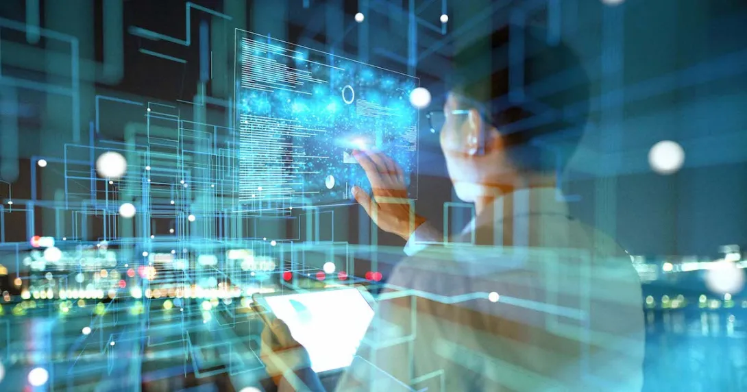 Person looking at images projected onto a wall with a city in the background Person looking at images projected onto a wall with a city in the background