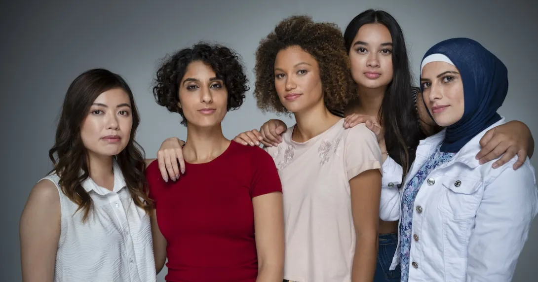 Five people standing next to each other facing the camera Five people standing next to each other facing the camera