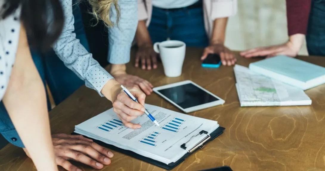 people looking at tablet, papers people looking at tablet, papers