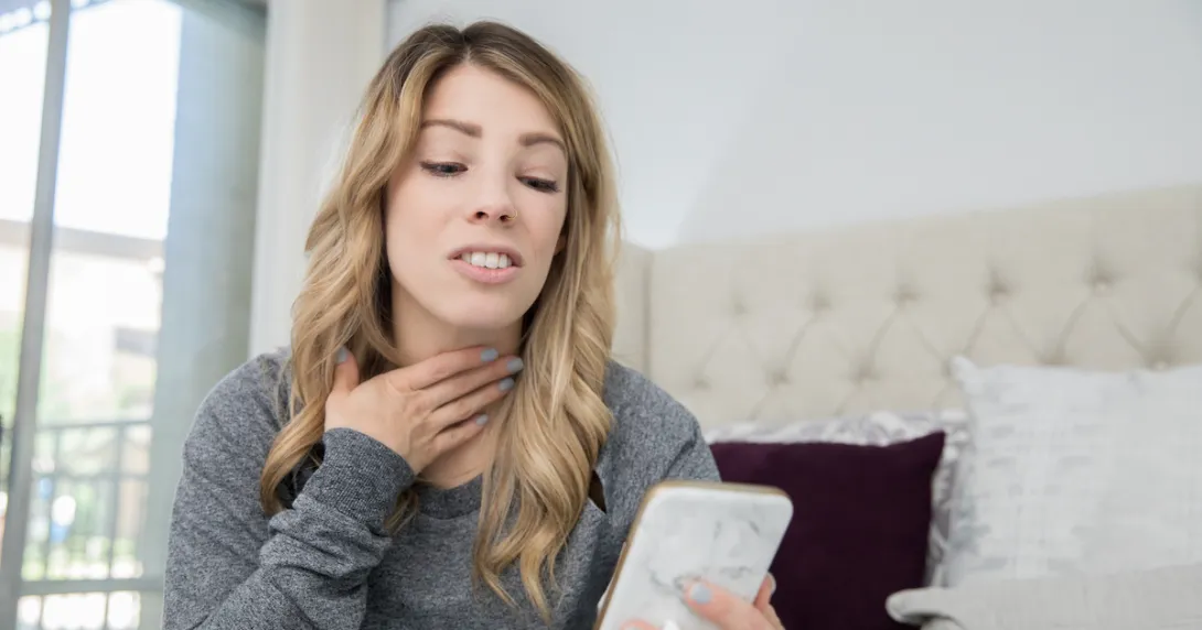 A woman participates in a telemedicine visit via smartphone A woman participates in a telemedicine visit via smartphone