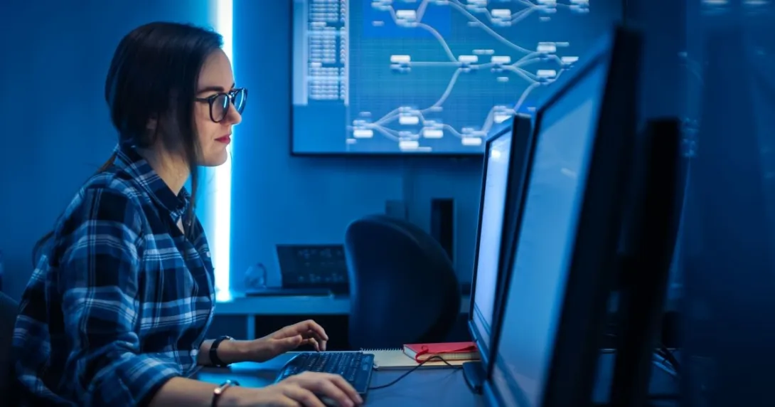 Person sitting at computer monitor Person sitting at computer monitor
