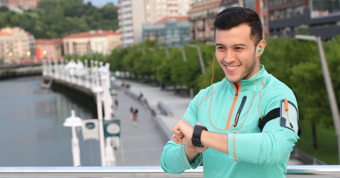 Person looking at their fitness watch Person looking at their fitness watch