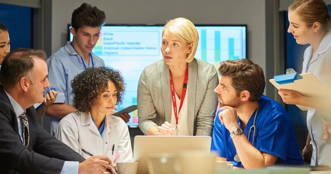 Medical personnel and executives in a conference Medical personnel and executives in a conference