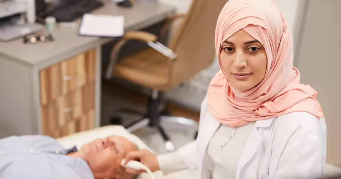 Technician performing an ultrasound exam Technician performing an ultrasound exam