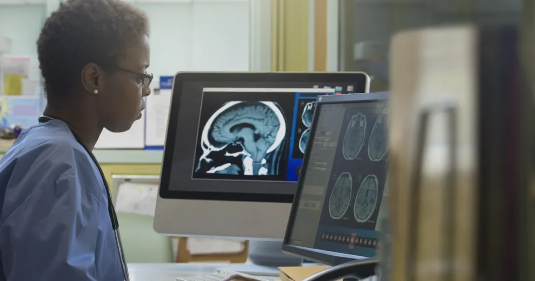 Healthcare professional examining an x-ray Healthcare professional examining an x-ray