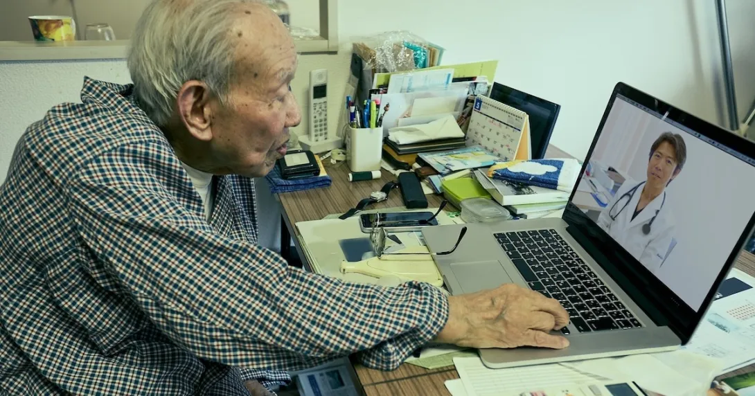 Person interacting with a healthcare professional via a telehealth visit Person interacting with a healthcare professional via a telehealth visit