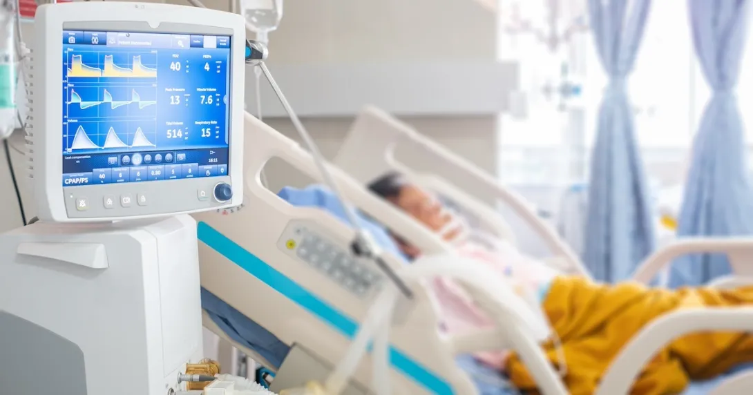 Image of patient in hospital with vital-sign-monitoring device Image of patient in hospital with vital-sign-monitoring device