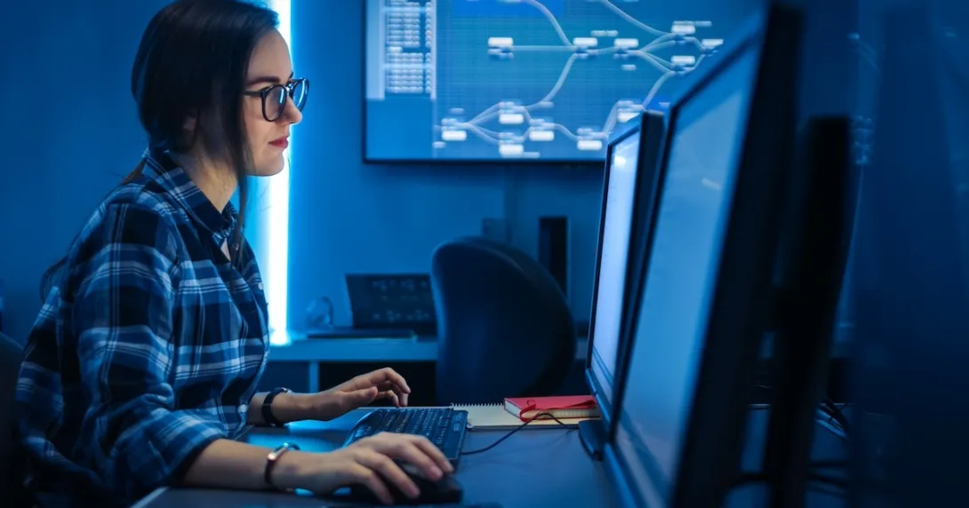 Technician looking at PC screen Technician looking at PC screen