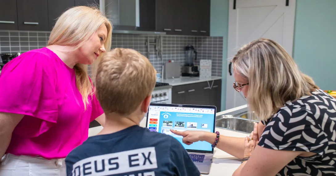 Professor Sonja March of USQ demonstrating the use of Momentum to a parent and child Professor Sonja March of USQ demonstrating the use of Momentum to a parent and child
