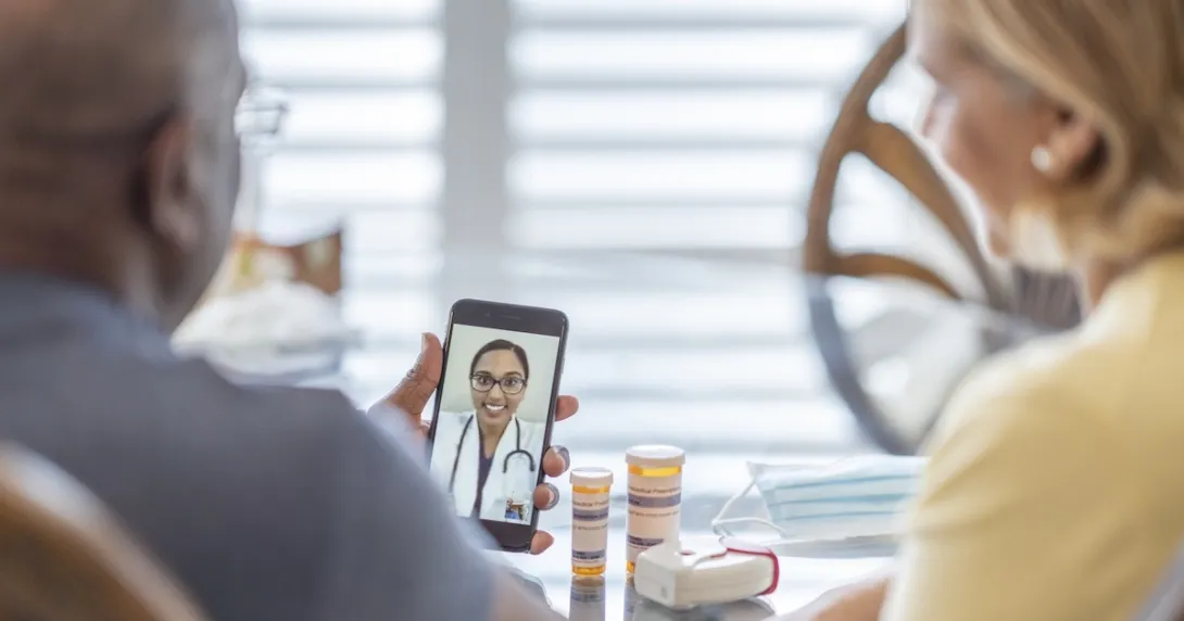 People interacting with a healthcare professional via a smart phone People interacting with a healthcare professional via a smart phone