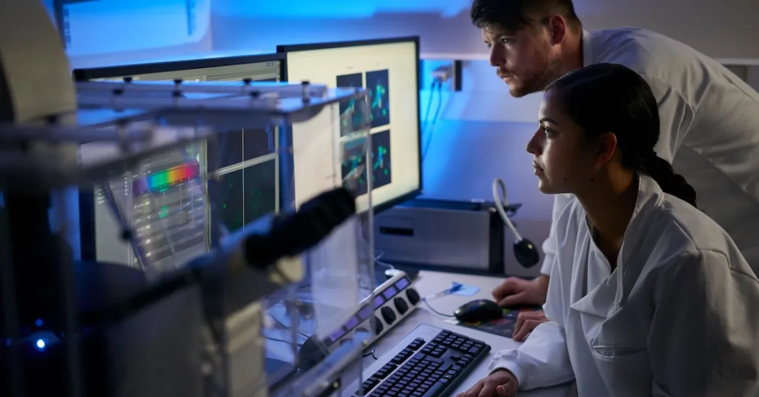 Healthcare professionals reviewing data on a computer Healthcare professionals reviewing data on a computer
