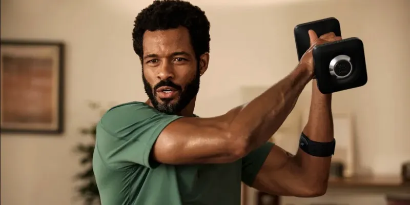 A man lifting a weight wearing the heart rate monitor A man lifting a weight wearing the heart rate monitor