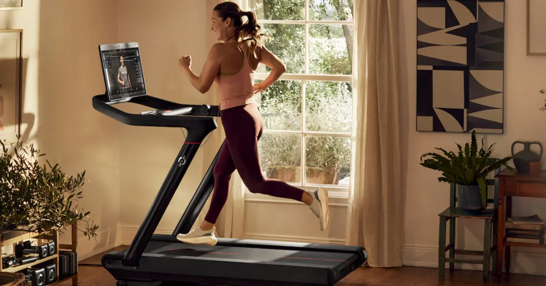 A person running on a Peloton treadmill A person running on a Peloton treadmill