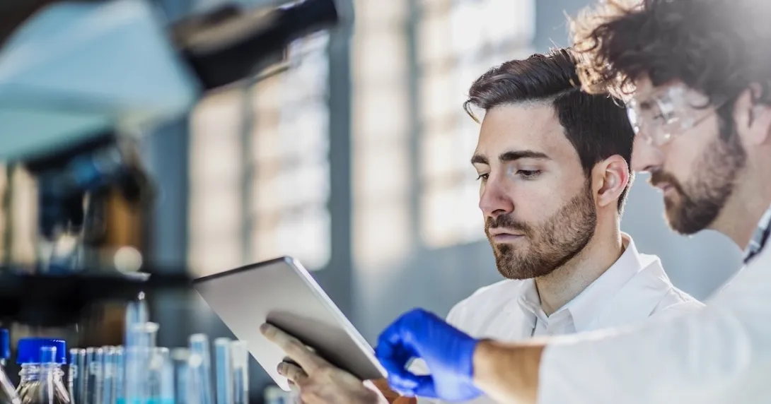 Two healthcare professionals looking at a tablet Two healthcare professionals looking at a tablet