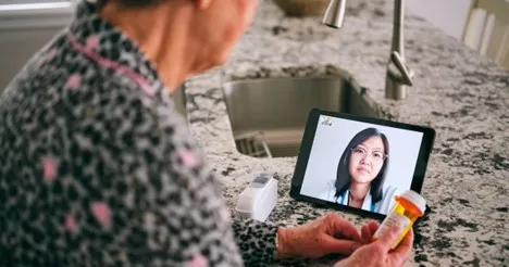 person looking at tablet screen person looking at tablet screen