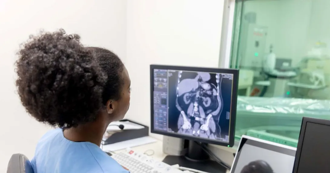 Radiologist looking at CAT scan monitor Radiologist looking at CAT scan monitor