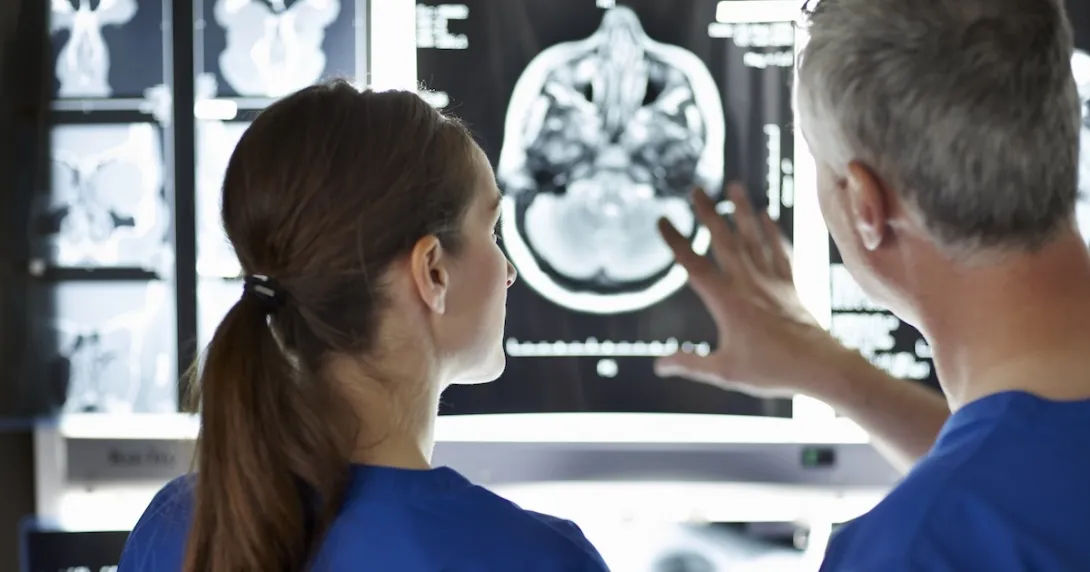 Healthcare professionals looking at MRI of the brain