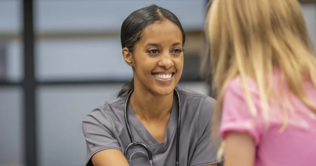 Person sitting with a school nurse Person sitting with a school nurse