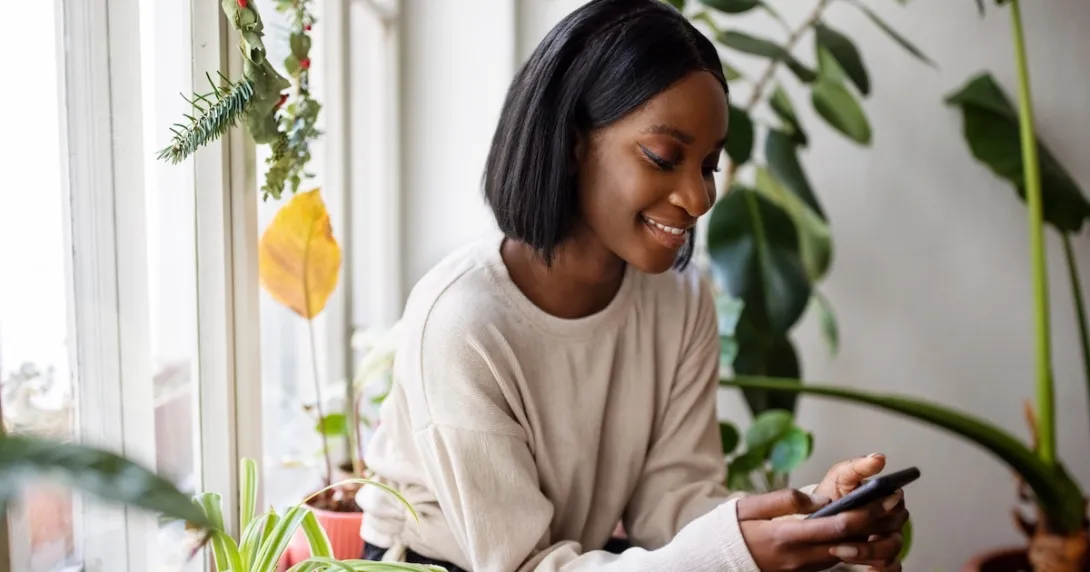 Young person communicating with a cell phone Young person communicating with a cell phone