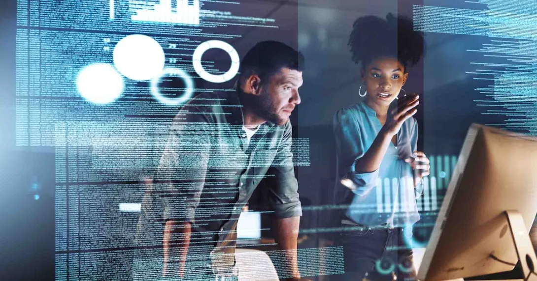 Two programmers working on code at night Two programmers working on code at night