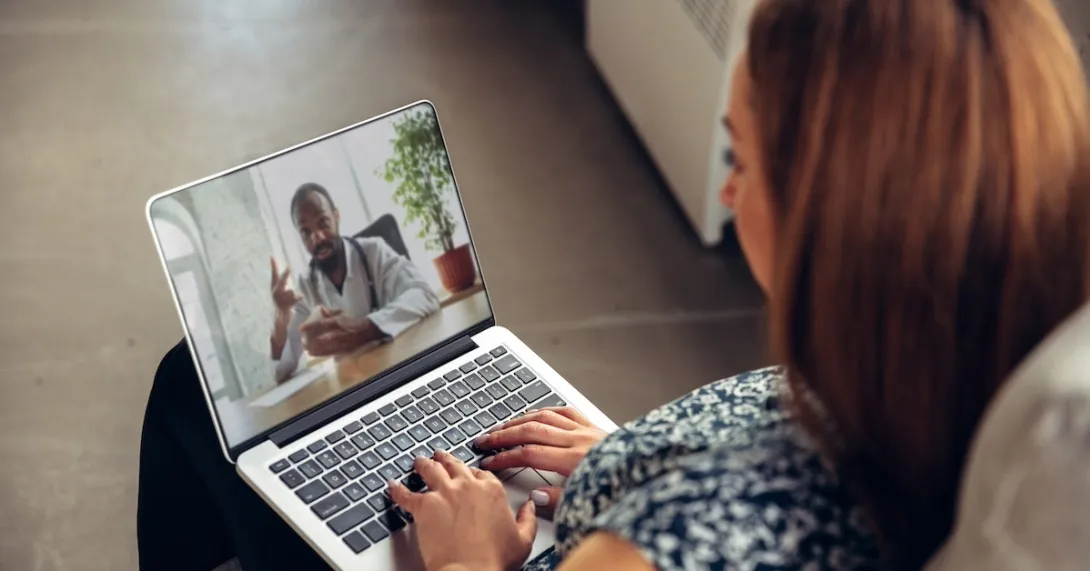 Patient consulting with healthcare professional virtually Patient consulting with healthcare professional virtually