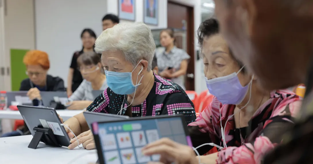 Seniors at Lions Befrienders playing the AMI app on their tablets Seniors at Lions Befrienders playing the AMI app on their tablets