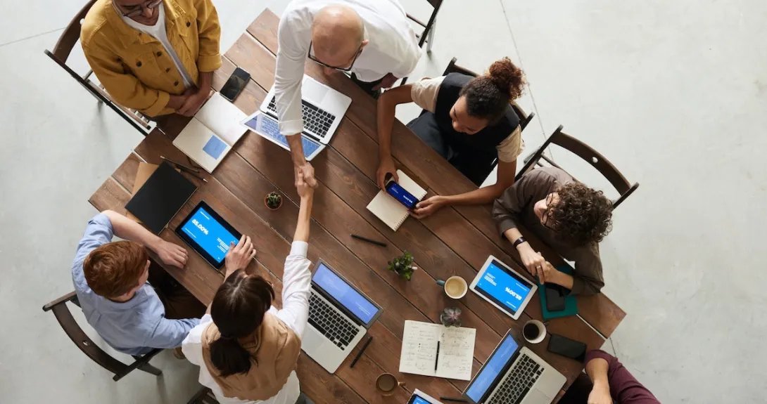 Business people shaking hands in a meeting