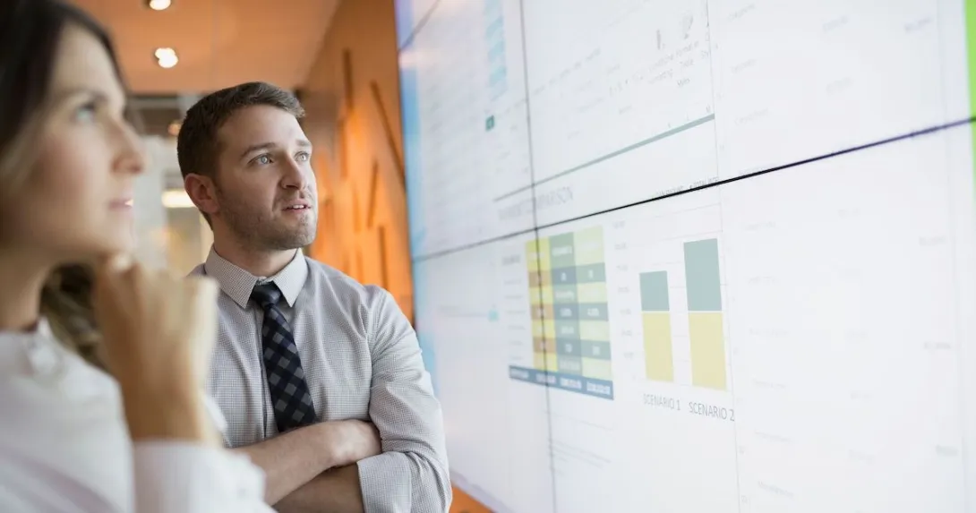 Businesspeople looking at financial results Businesspeople looking at financial results