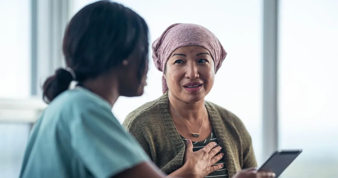 A cancer patient talking to a provider. A cancer patient talking to a provider.