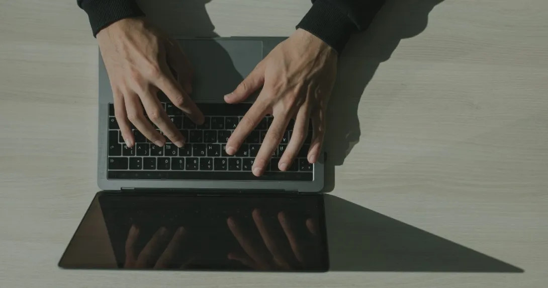 Person typing on a laptop